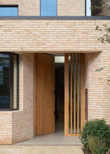 a modern new build in the Wandsworth Common Conservation Area. Balancing tradition and innovation, this sustainable home enhances its historical surroundings with a sleek design, energy-efficient features, and thoughtful architectural details.