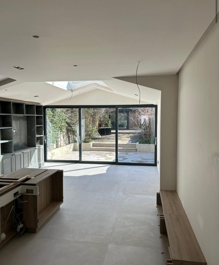 Modern rear extension with large glazing on a renovated period house in Southwest London