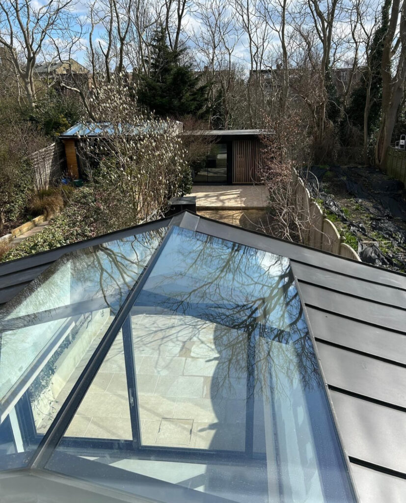 The new zinc roof and apex skylight bring light and architectural flair to the SW London rear extension.